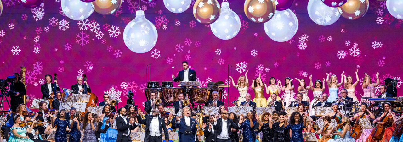 An image of the Andre Rieu Christmas movie featuring a stage full of performers
