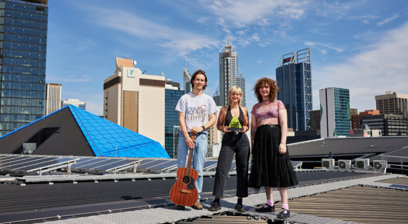 The winners of the 2023 Limelight music support fund standing on the roof at RAC Arena